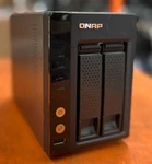 Qnap TS-221 Network Attached Storage Drive W/ 2X Caddys No Hdd. Fixed Price $53.76.